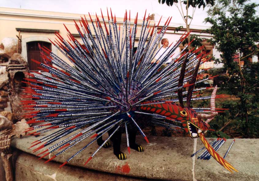 Colorful animal wood carvings are sold all over Oaxaca.  This one caught my eye and I wish now that I had purchased it.  How to get it home?  Dissassemble, bundle it up, and then reassemble at home.