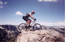 Balancing on a rock in Tahoe area (134K)